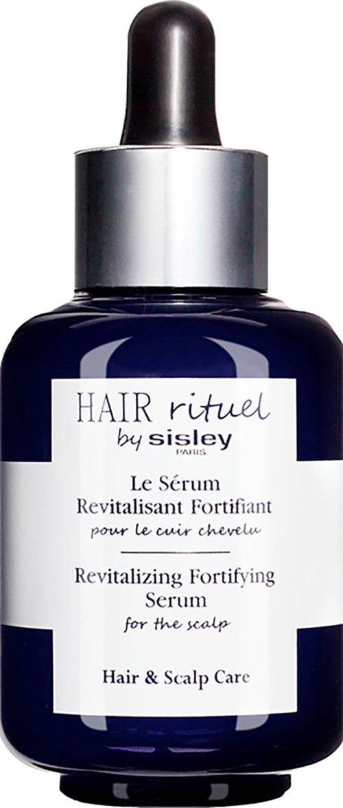 Donkerblauwe fles met pipet, gelabeld als versterkend haar- en hoofdhuidserum.