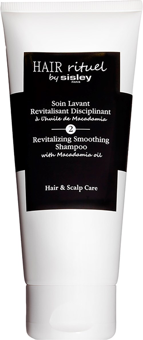 Herstellend en kalmerend shampoo met macadamia olie, voor haar- en hoofdhuidverzorging, in een witte tube met zwart label.