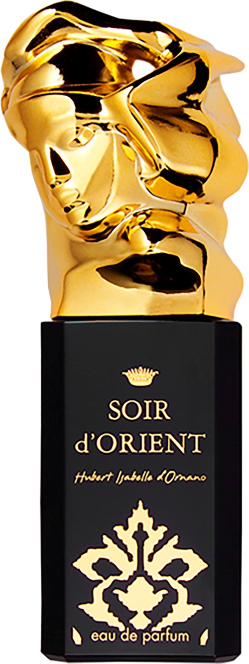 A black perfume box with gold text and a floral design, topped with a shiny gold sculpture of a face.