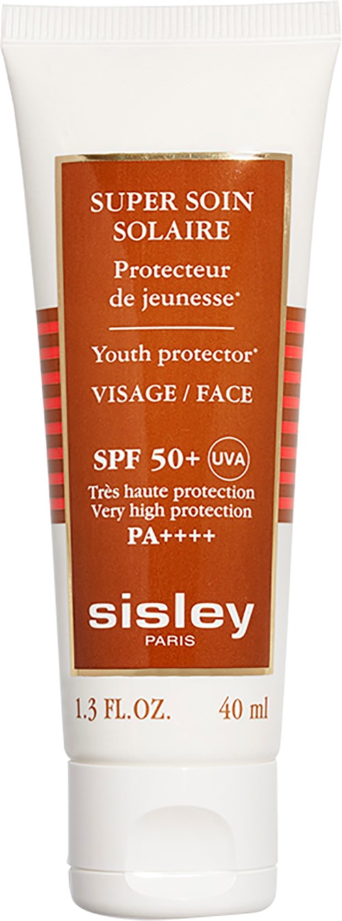 Witte tube zonnebrandcrème met label 'Super Soin Solaire' voor gezicht, met hoge bescherming SPF 50+ en UV-bescherming.