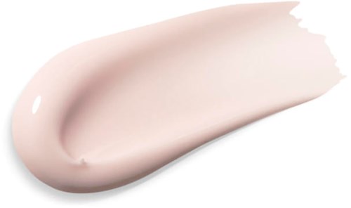 Eine beige Creme oder Lotion, verteilt auf einem weißen Hintergrund, mit einer glatten, gebogenen Form.