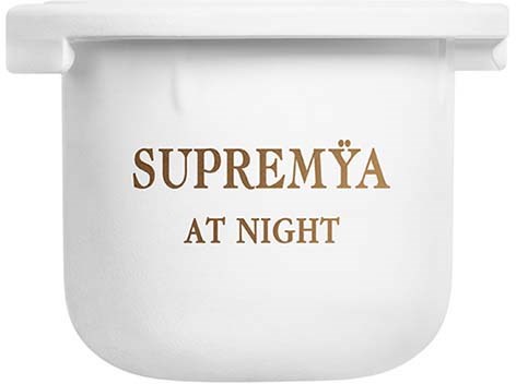 Dit is een witte container met de woorden 'SUPREMYA AT NIGHT' in bruin.