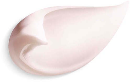 A dollop of creamy, white lotion or cream shaped like a teardrop on a black background.