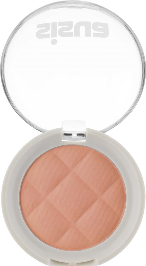A round compact with peach-colored powder, a clear lid, and a white base. The lid has text upside down.