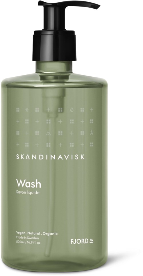 En grønn flaske med pumpe merket Skandinavisk Wash, laget i Sverige, vegansk og økologisk.
