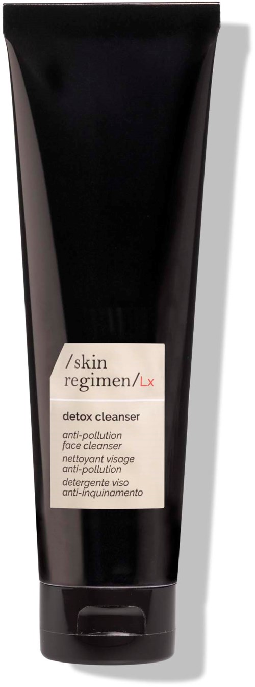 A black tube of skin regimen detox cleanser for anti-pollution face cleansing. Includes a label with product details.