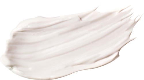 Weiße Creme gleichmäßig auf einer Oberfläche verteilt, cremige Textur. Kein Etikett oder Objekt, nur ein Klecks Weiß.