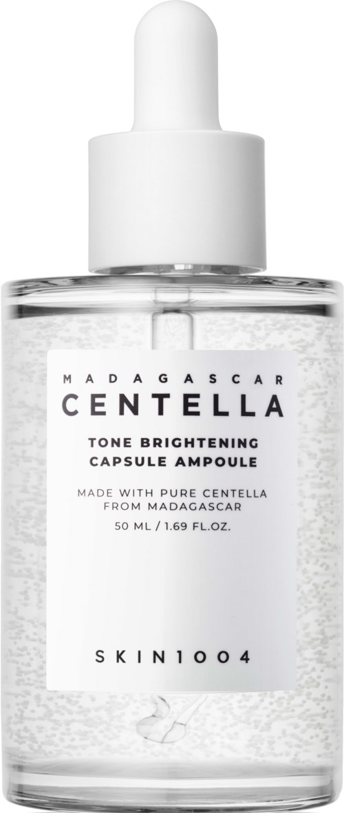 Eine klare Glasflasche mit Pumpenspender, beschriftet als Madagascar Centella tone brightening capsule ampoule, 50 ml.