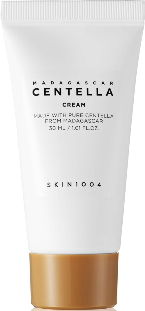 Eine weiße Tube Madagascar Centella Creme mit goldener Kappe, gekennzeichnet mit Produktdetails und Markenname.