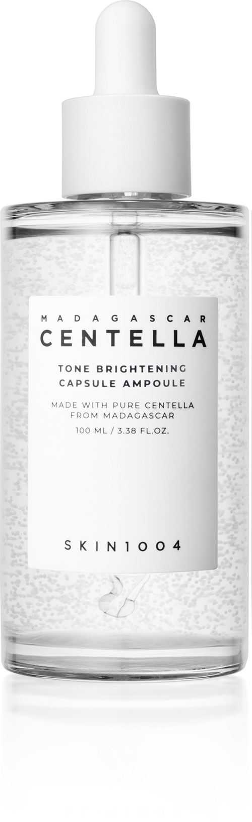 A clear bottle with a white dropper cap. The label says Madagascar Centella tone brightening capsule ampoule.