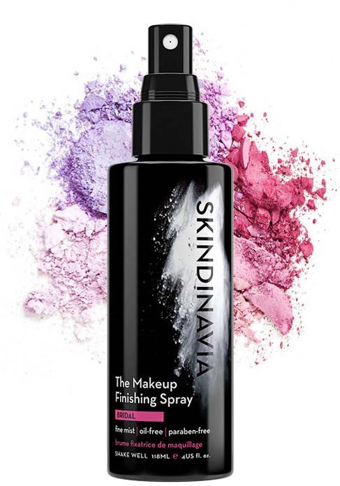 Schwarze Sprühflasche für Make-up-Finalisierungsspray mit bunten Pulverstaub hinter sich.