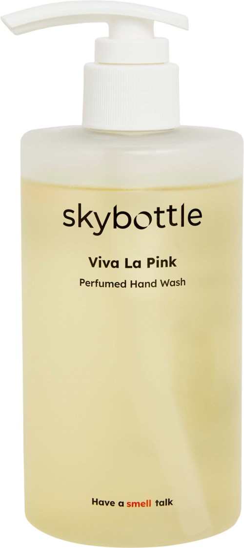 Pumppupillinen pullo, jossa lukee 'skybottle Viva La Pink Perfumed Hand Wash','taustalla yksinkertainen.