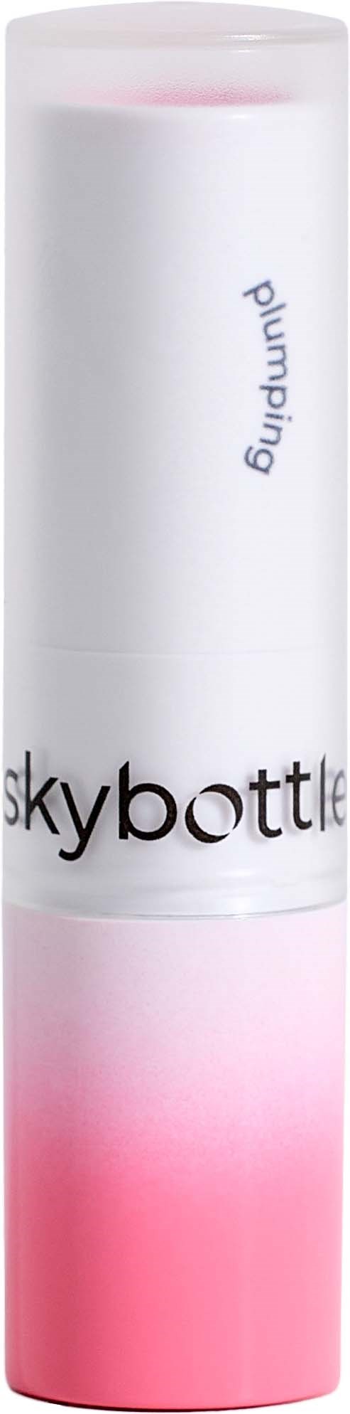 Valkoinen ja vaaleanpunainen sylinterinen säiliö, jossa lukee 'skybottle' ja 'pumping', seisoo pystyasennossa.