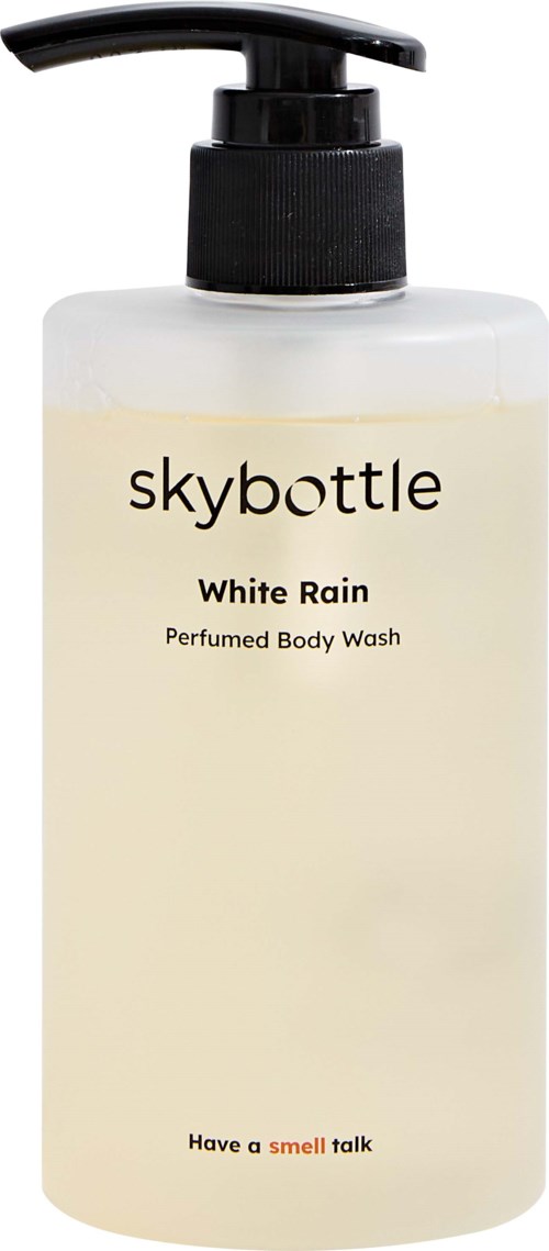 En vit flaska med pump, märkt 'skybottle' som innehåller doftande kroppsvask kallad 'White Rain' och en slogan.
