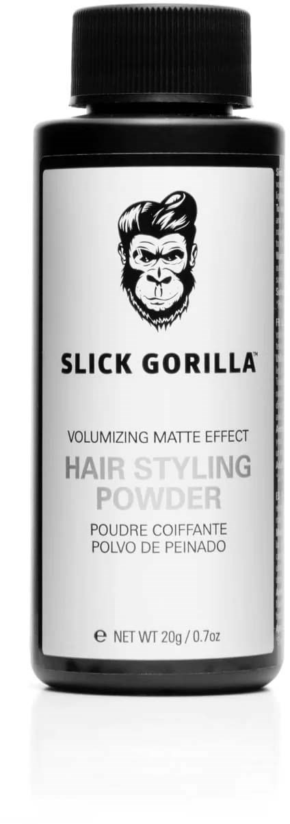 Een zwart flesje met een etiket dat een gorillagezicht en tekst voor haarstylingpoeder toont.