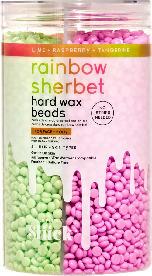 Bunte Perlen in einem transparenten Behälter, beschriftet als rainbow sherbet Wachsperlen für Gesicht und Körper.