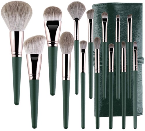 Set of makeup brushes in various sizes with green handles, stored in a green holder.