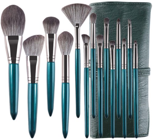 Set of makeup brushes with blue handles, including large and small brushes, and a gray roll-up case.