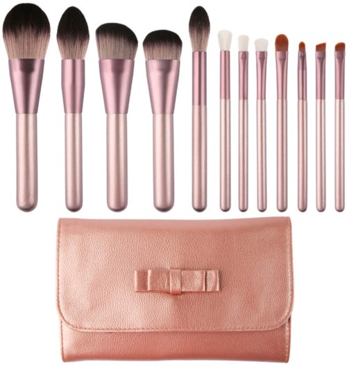 Set of makeup brushes with a pink case, including various brushes for face and eye makeup.