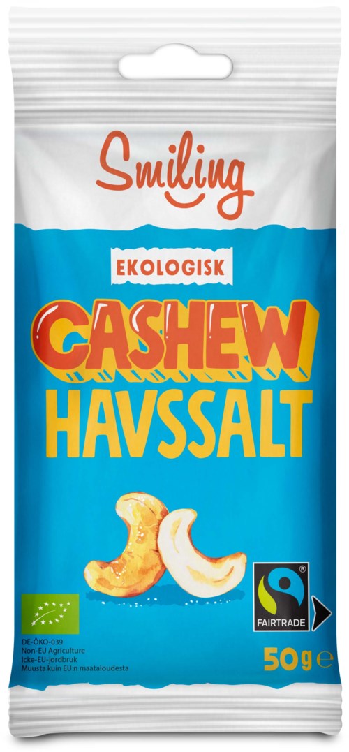A package of organic cashew salt, with a smiling brand name. It shows cashew nuts and a fairtrade logo.