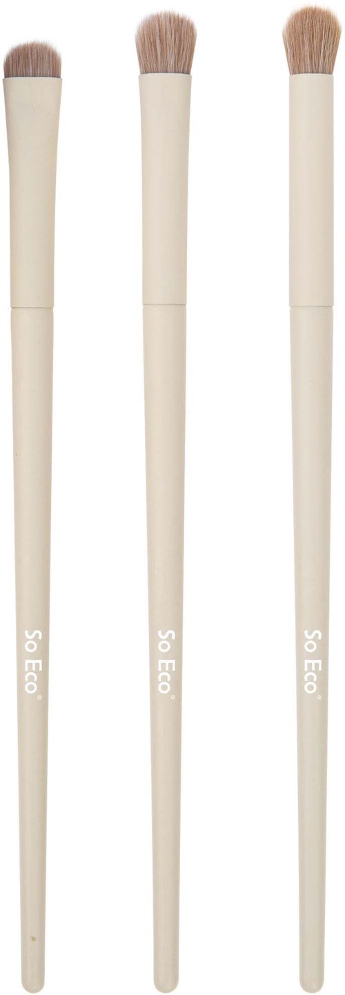Three makeup brushes with beige handles and soft bristles. They are aligned vertically. The brushes are clean and new.