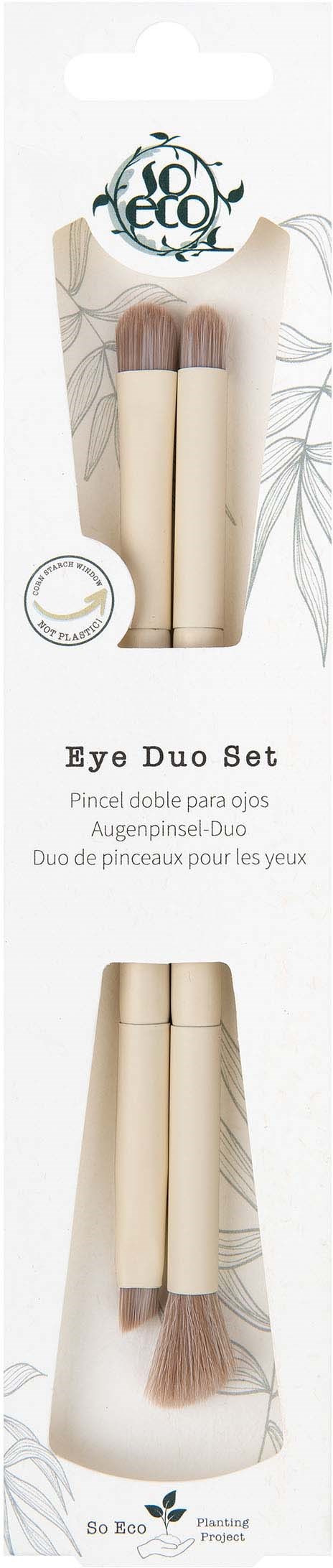 Eco-friendly eye brush set with two brushes and beige handles, displayed on a white background with leaves.