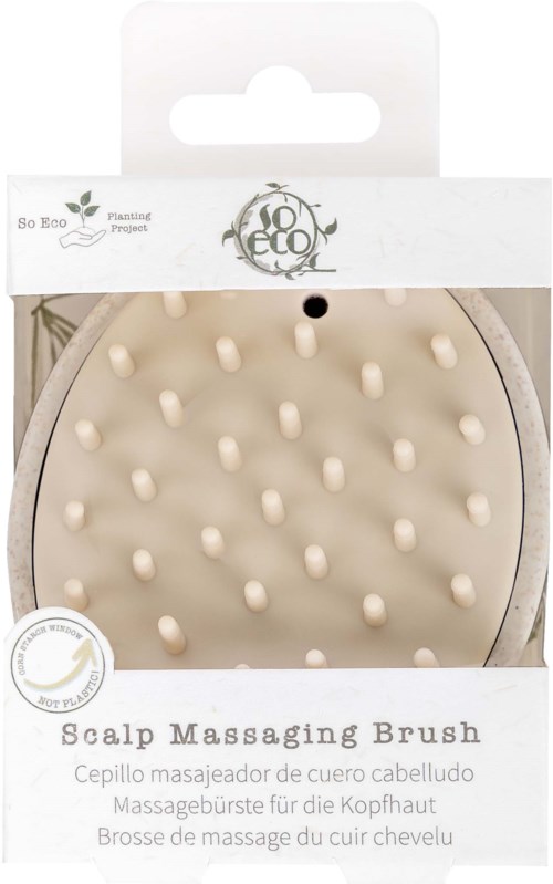 A scalp massage brush with soft bristles, packaged in a white box with the brand name and product details.