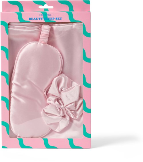 Pink sleep mask and scrunchie inside packaging, labeled 'Beauty Sleep Set.'