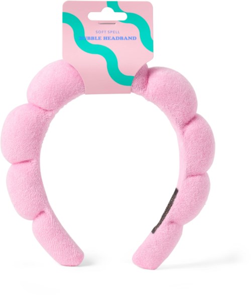 A pink soft headband with bubble shapes and packaging label saying 'Bible Headband.'