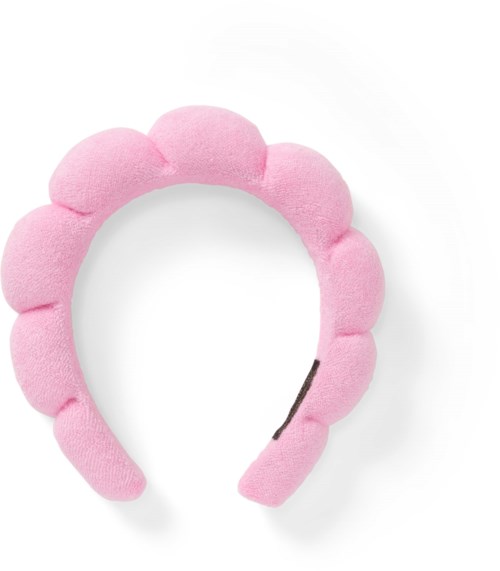 Pink fluffy headband with rounded bump decorations, open at the back, on a white background.