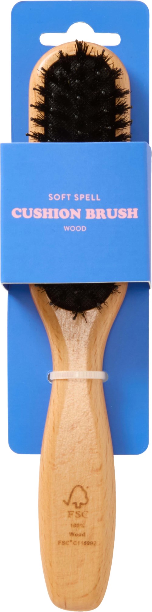 Ein Holzgriffkissenpinsel mit schwarzen Borsten in blauer Verpackung mit der Aufschrift 'Soft Spell Cushion Brush.'