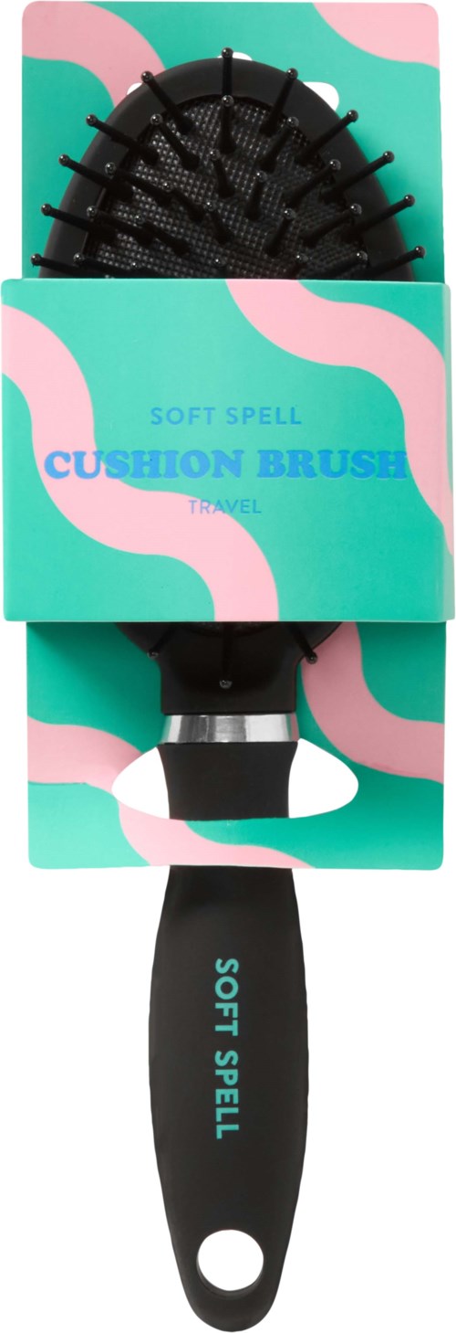Eine schwarze Haarbürste mit blauer und pink Verpackung, die "Soft Spell Cushion Brush" sagt.