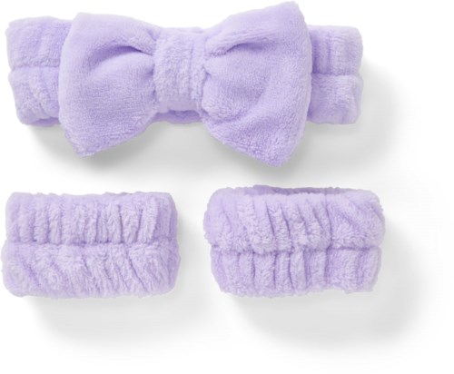 Lavender headband with a bow and two matching scrunchies. Soft, fuzzy fabric looks cozy.