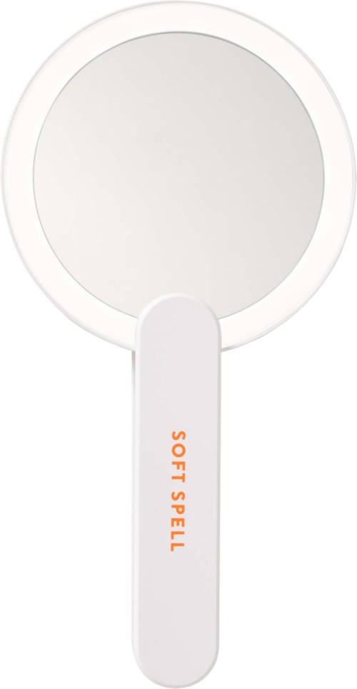 A white handheld magnifying glass with an orange label that says "SOFT SPELL."