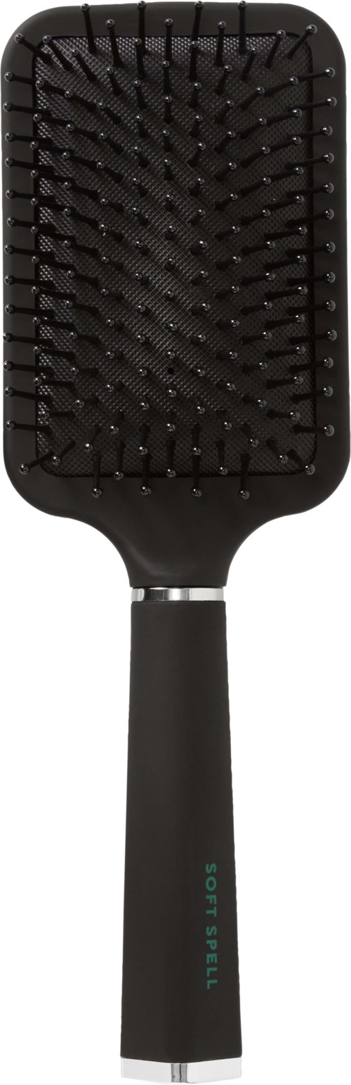 A black hairbrush with a rectangular shape, many bristles, and a handle labeled "Soft Style".