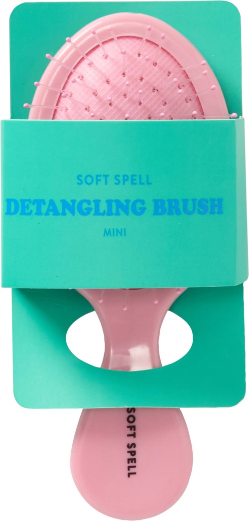 En liten rosa kam for å gre ut hår, i blå emballasje merket 'Soft Spell' og 'Detangling Brush Mini' med et håndtak.