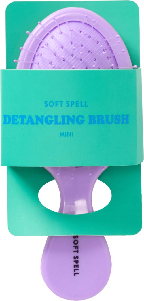 En liten lilla kam for å gre ut hår, i en turkis eske merket "Soft Spell Detangling Brush Mini."