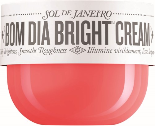 Ein pinker Behälter mit weißem Deckel, beschriftet mit 'Bom Dia Bright Cream' von Sol de Janeiro, für Hautaufhellung.