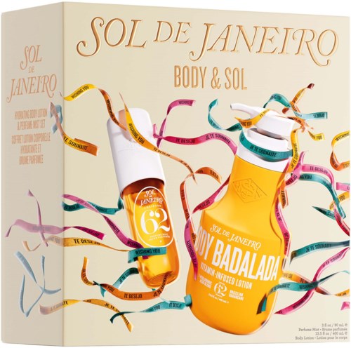 The box features two yellow bottles of Sol de Janeiro body lotion with colorful ribbons swirling around.
