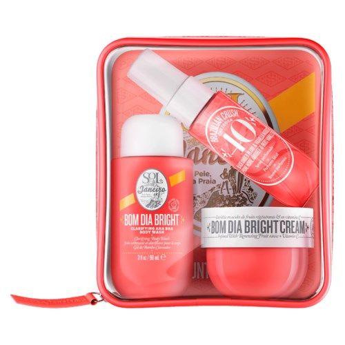 Ein Hautpflegeset mit aufhellendem Duschgel, Creme und Spray in einem roten Behälter.