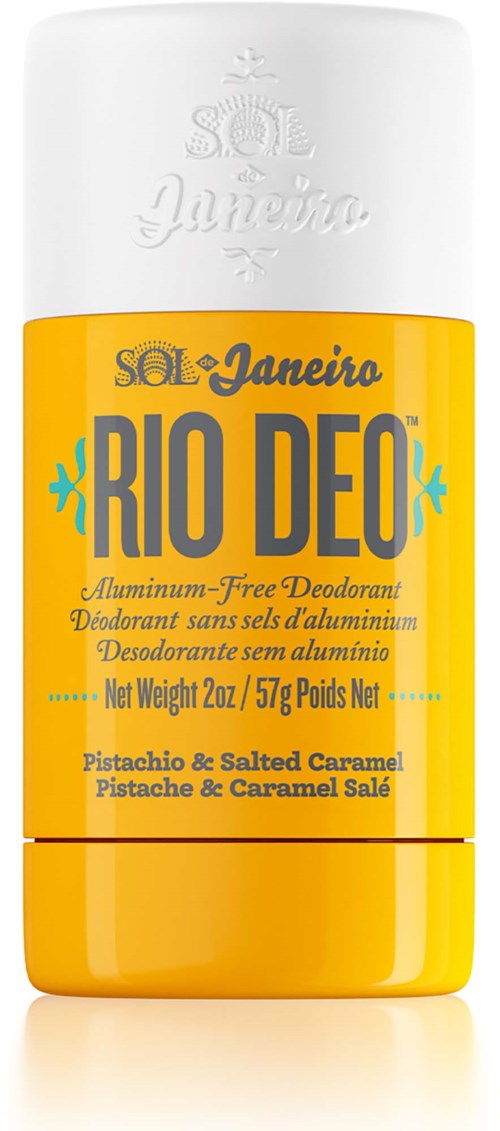 Keltainen ja valkoinen deodorantti, jossa on musta teksti. Siinä lukee Rio Deo, pistaasi ja suolainen karamelli tuoksu, 2 oz.