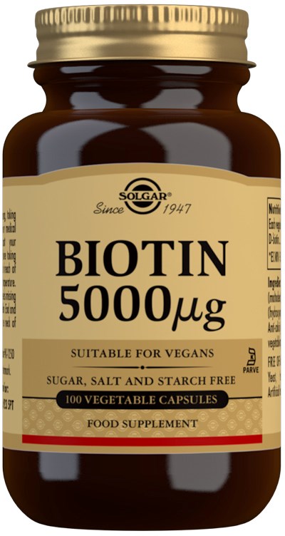 A brown bottle labeled Biotin 500 micrograms, suitable for vegans, with 100 vegetable capsules inside.
