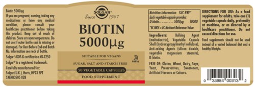 A supplement label for Biotin 5000 micrograms, containing ingredients like bulking agents and vitamins, suitable for vegans.