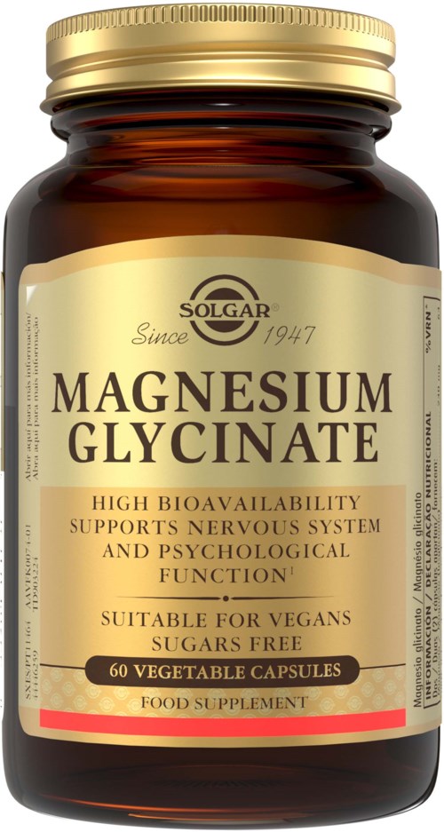 En mörkbrun burk med guldkork med magnesium glycinat kosttillskapskapslar.