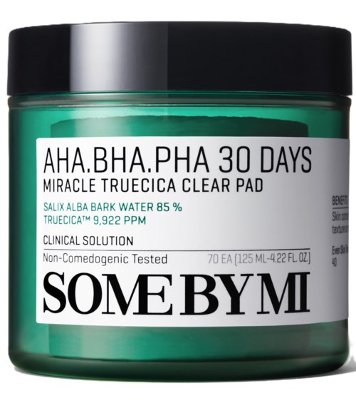 A green jar with a black lid containing skin care pads, labeled 'SOME BY MI' and mentioning a 30-day treatment.