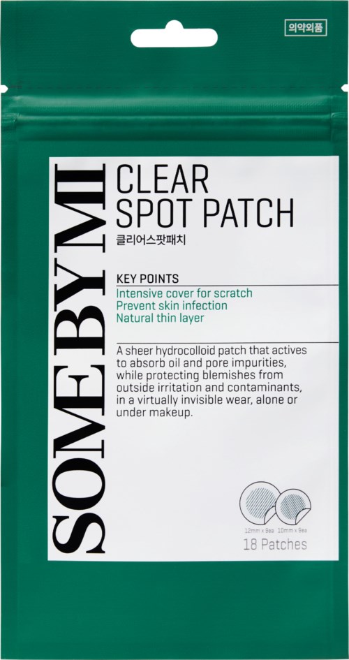 A green package with white and black text showing clear spot patches for skin problems.