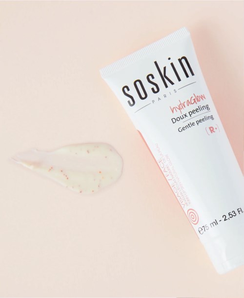 A tube of Saskin Hydraglow gentle peeling with some product spilled beside it.