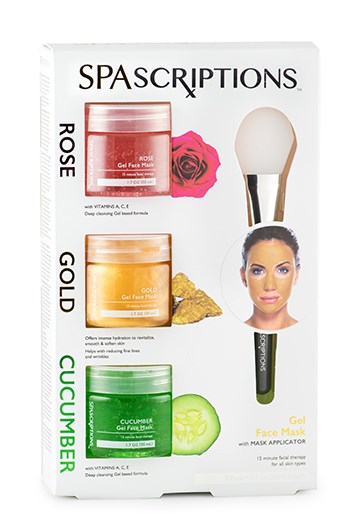 Een doos bevat drie potjes gezichtsmasker in rood, goud en groen, samen met een kleine spatel voor applicatie.