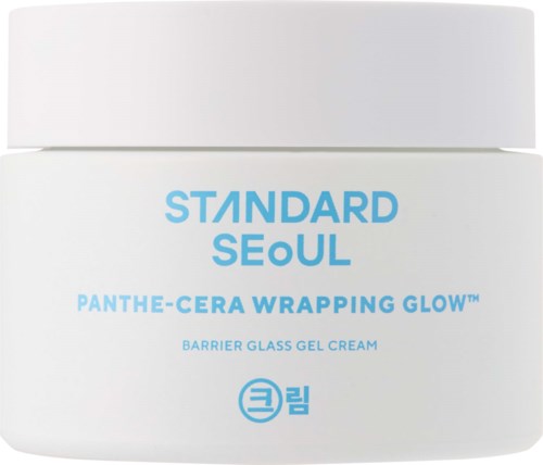 A white jar with blue text shows a skincare product called Standard Seoul Panthe-Cera Wrapping Glow.