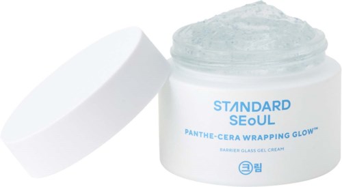 A jar of facial cream with blue and white label, open with cream visible inside.